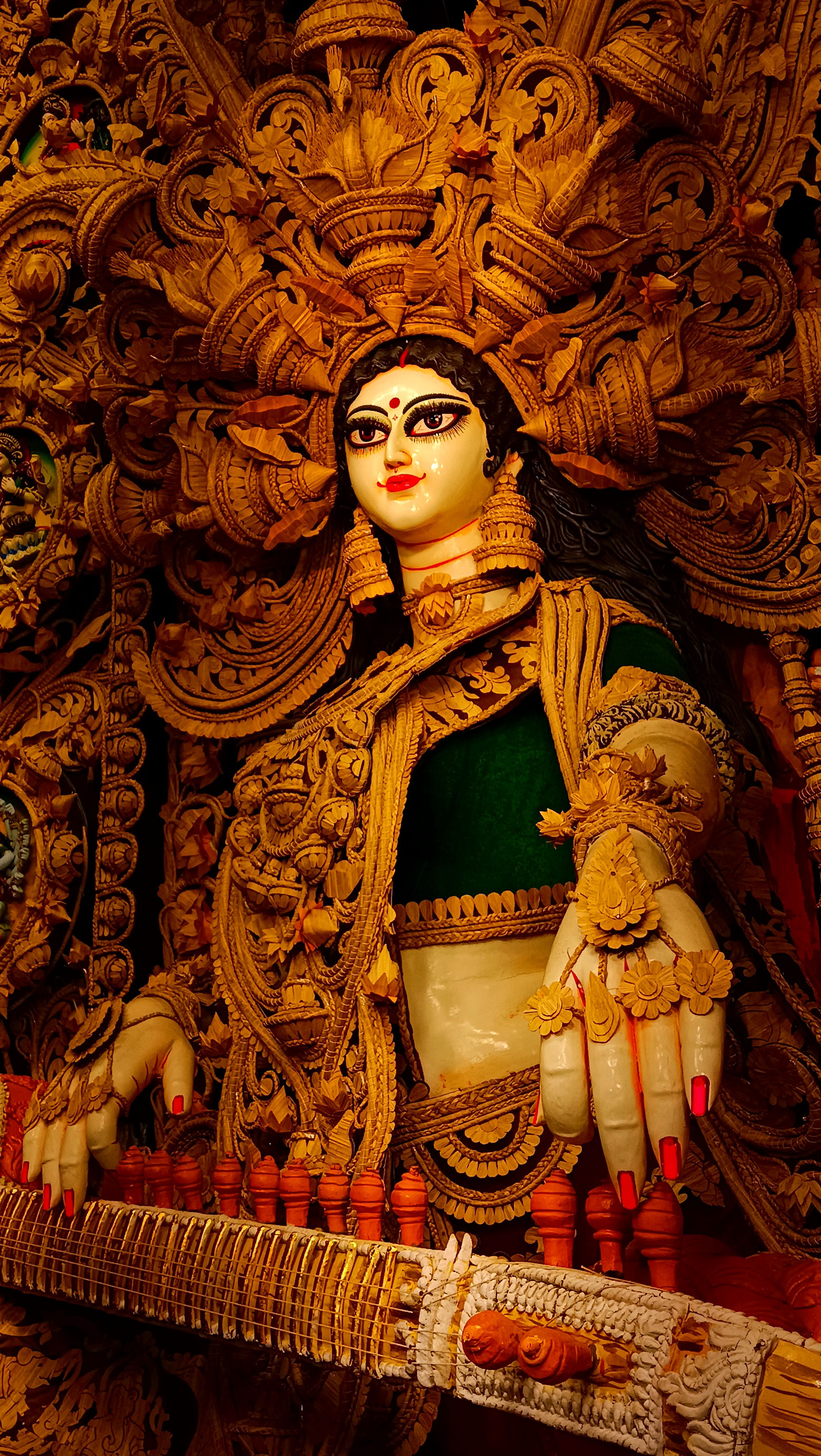 A sholapith straw-craft Saraswati idol playing the veena — photo via Pexels / anubhav24